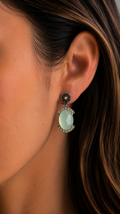 Silver chalcedony earrings with a circus border and champagne-colored details