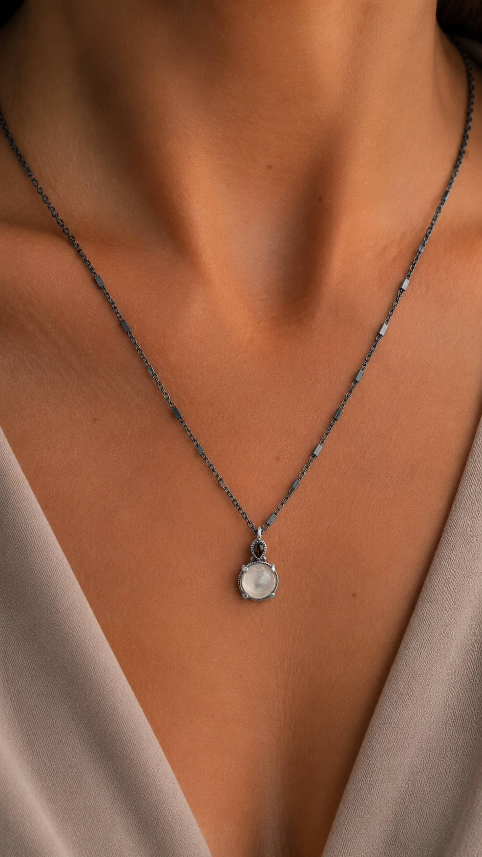 Small silver pendant with moonstone and brown drop